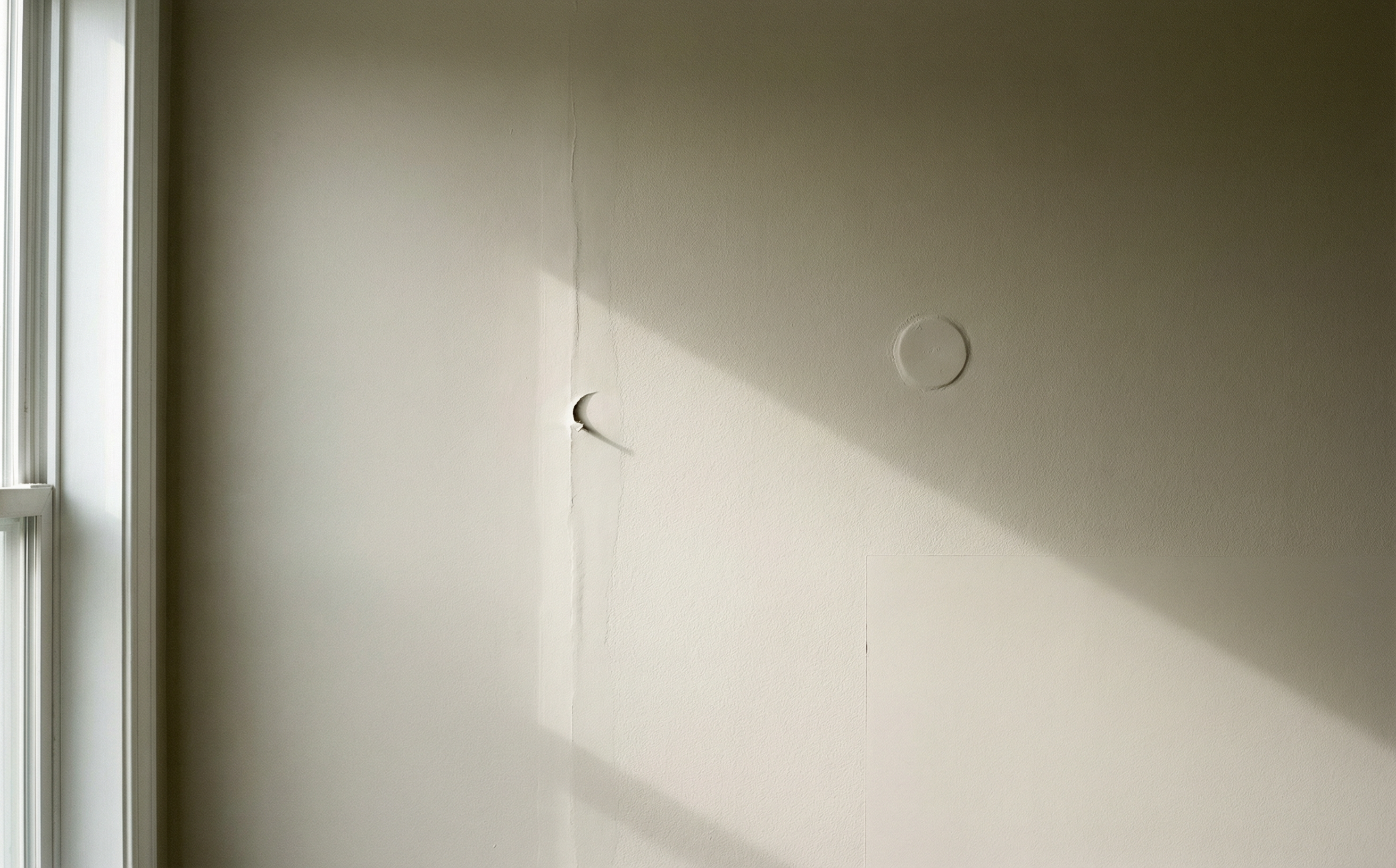 Common DIY wall prep mistakes — visible patches and unfilled gaps that show through fresh paint by